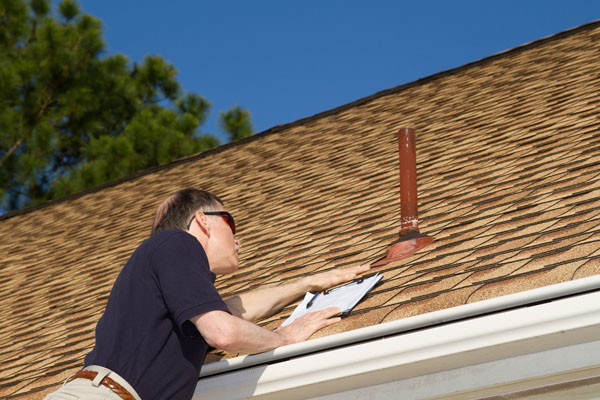 Oakland roofing contractor performing roof inspection