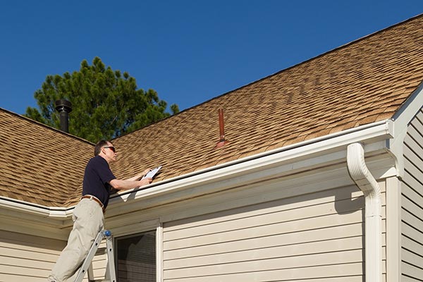 Oakland roofing contractor performing roof inspection